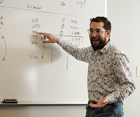 sustainability-landing-page-spotlight-man-whiteboard